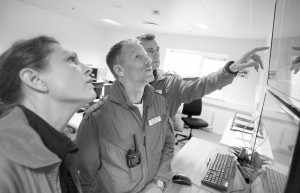 Crew study weather and maps prior to a mission. Denmarks first air ambulance serivce, operated by Norwegian Air Ambulance. The crew is pilot Jan Nielsen, HEMS paramedic Lars Greve-Wilms and doctor Rikke Helene Rasmussen. The crew operate an Airbus EC-135 out of the Ringsted base, one of three bases in Denmark.