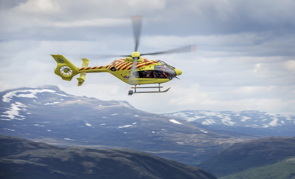 Rescue paramedic Christen Tellefsen on the topic of safety when hiking in the mountains. The rest of the crew is pilot Ole Anders Listad and doctor Tore Dahlberg. Norwegian Air Ambulance (Norsk Luftambulanse) EC-135 helicopter based at Dombås. ©Fredrik Naumann/Felix Features